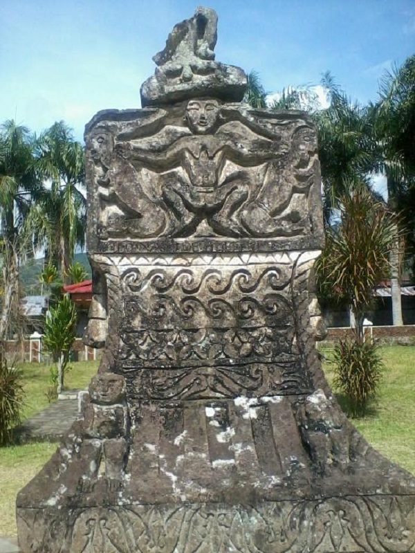 A carved Minahasa heritage stone with figure reliefs